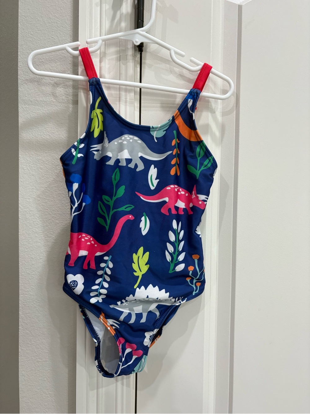 Blue with dinosaur pattern one piece swimsuit girls size small GUC